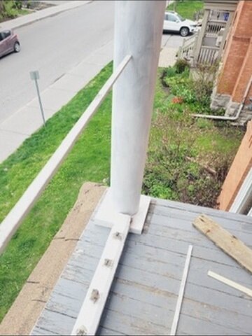 Second-floor balcony with original railing removed, ready for custom replacement - Ottawa Handiman