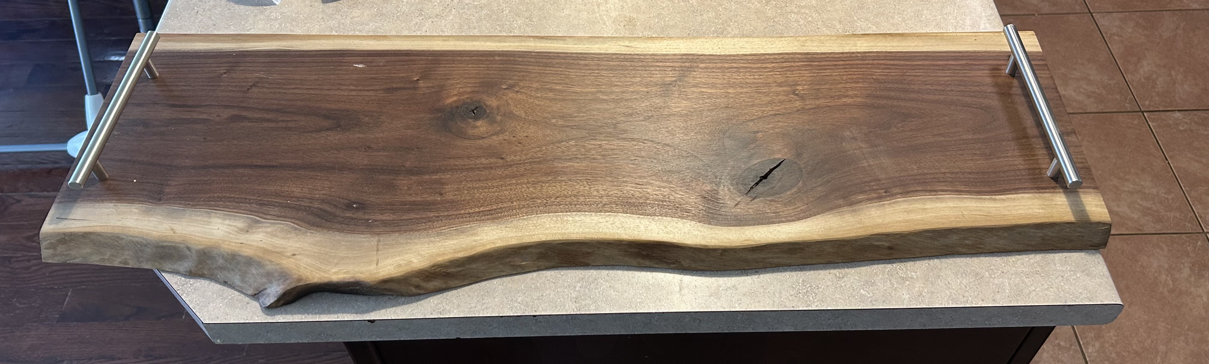 Custom live-edge walnut charcuterie board with metal handles - Ottawa Handiman