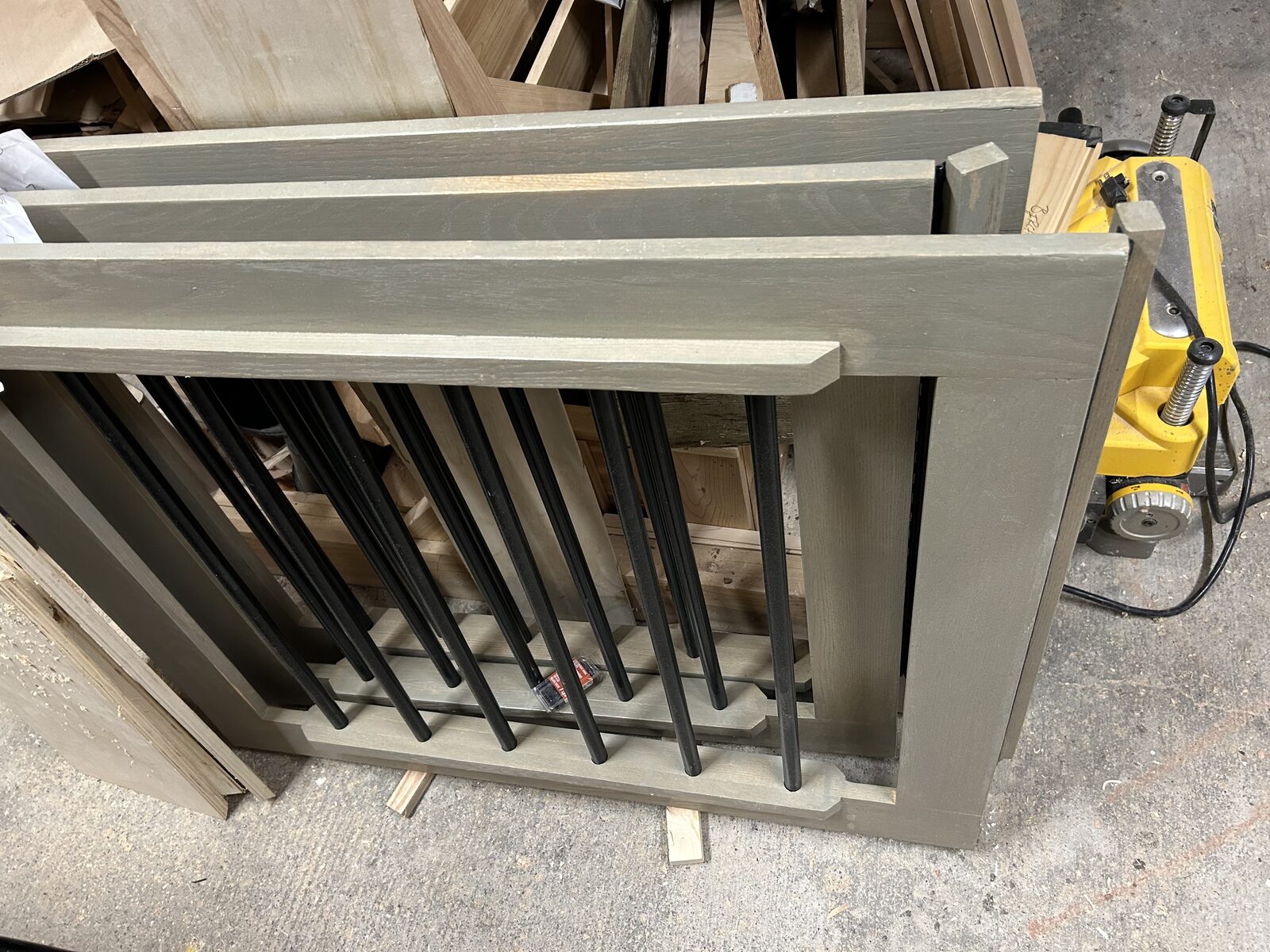 Custom baby gates with grey frames and black spindles assembled in the workshop - Ottawa Handiman