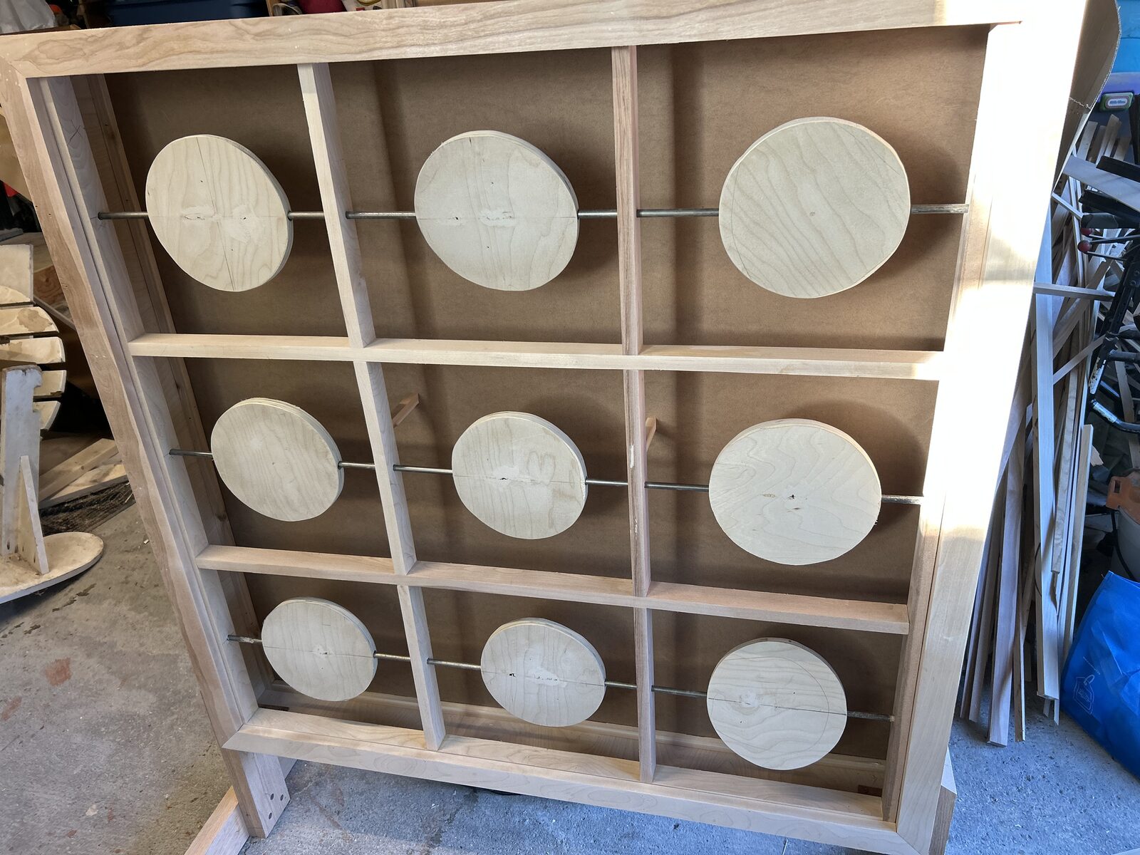 Custom baby reveal tic-tac-toe board with nine spinning wooden discs in a free-standing frame - Ottawa Handiman