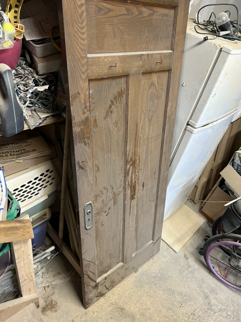 Original heritage oak panel door from Glebe Ottawa home used as reference for custom replication by Ottawa Handiman