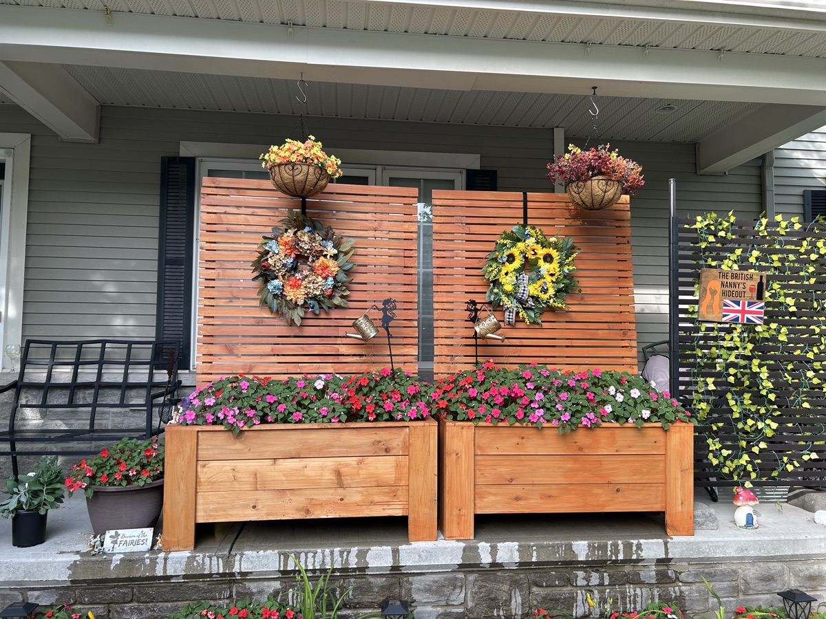 Cedar planter boxes with detachable privacy fence installed and planted on a porch - Ottawa Handiman